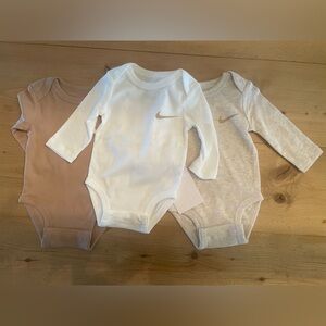 NWT. Set of 3 NIKE Long Sleeve Bodysuit/Onsie. Size 3 Months.